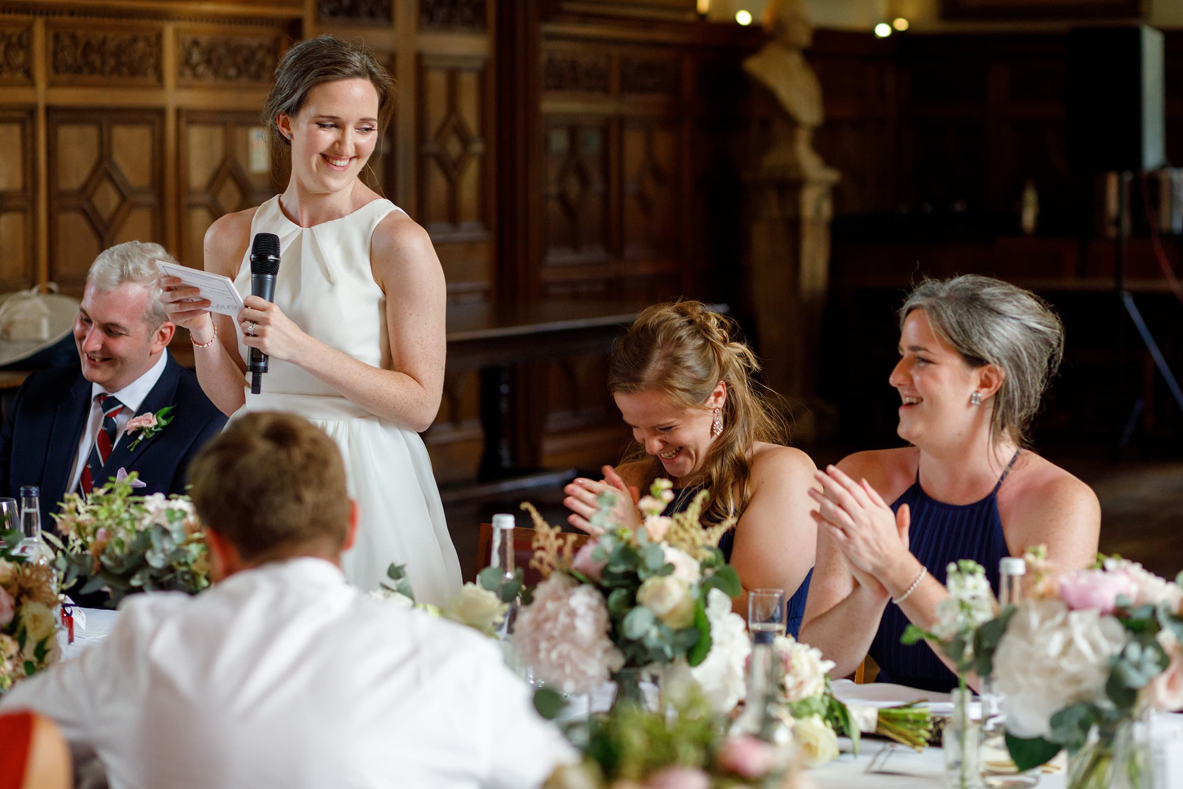 bridesmaids laugh at the brides speech