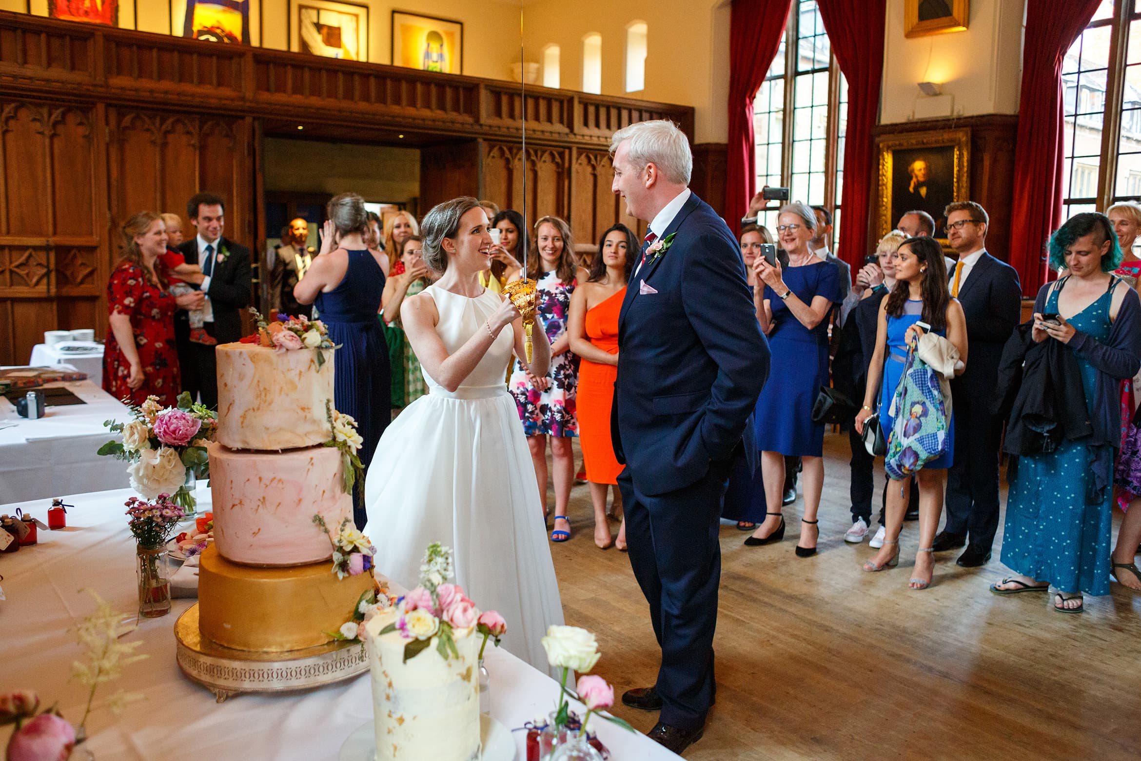 cutting the cake with a sword