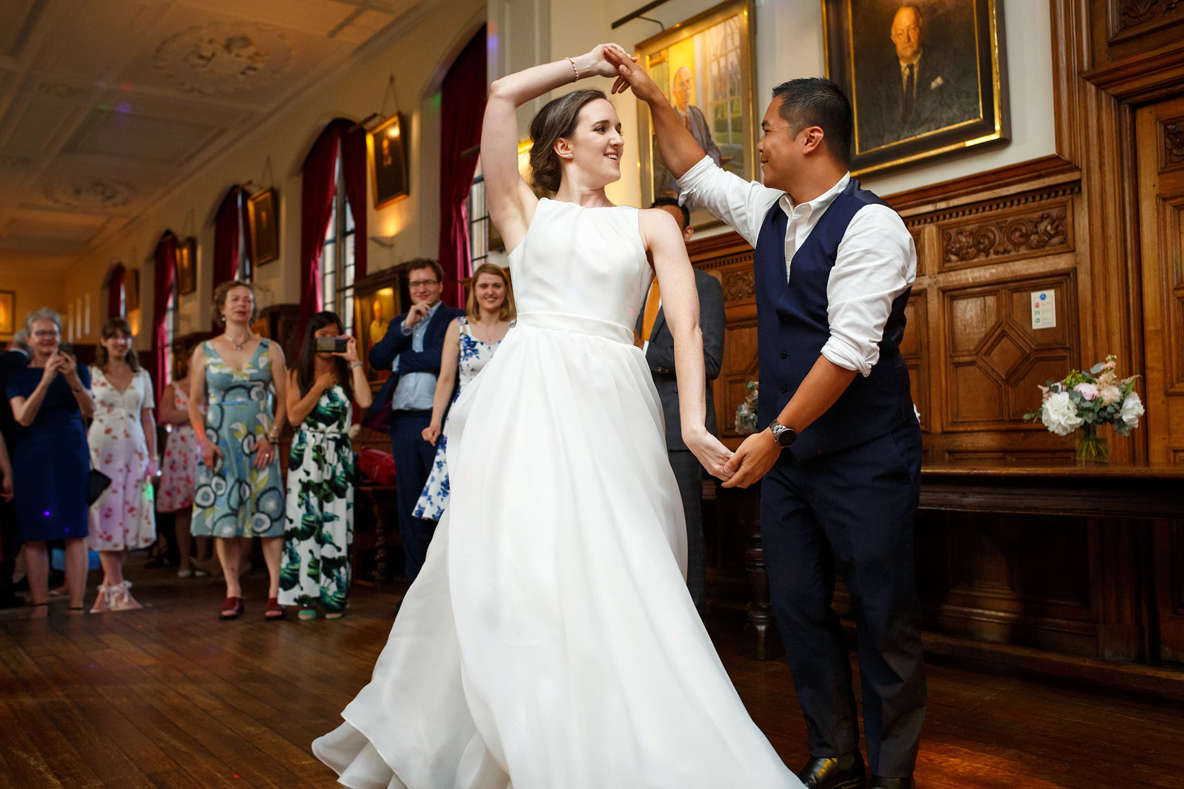 the bride dances with a guest