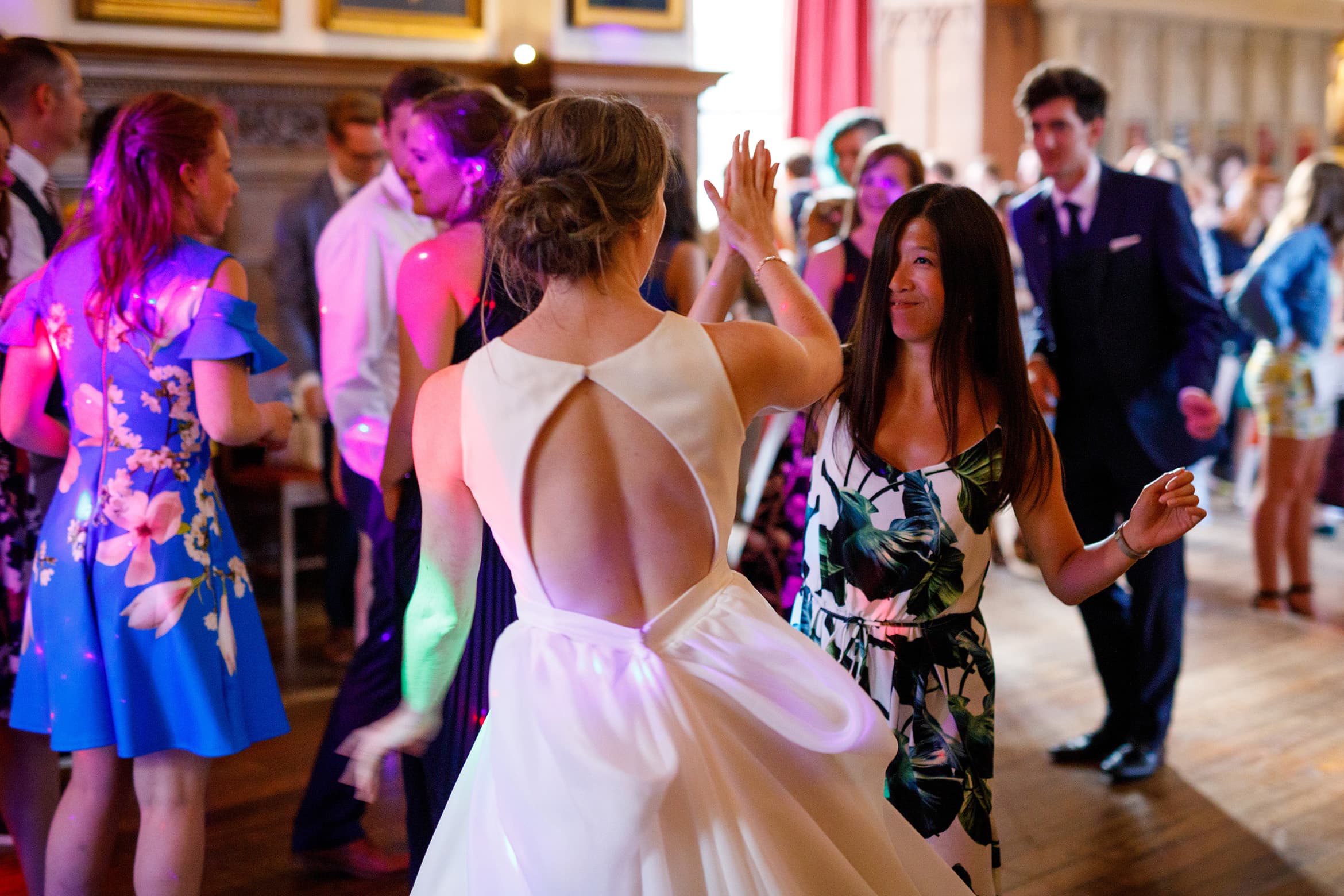 the bride dances with a guest