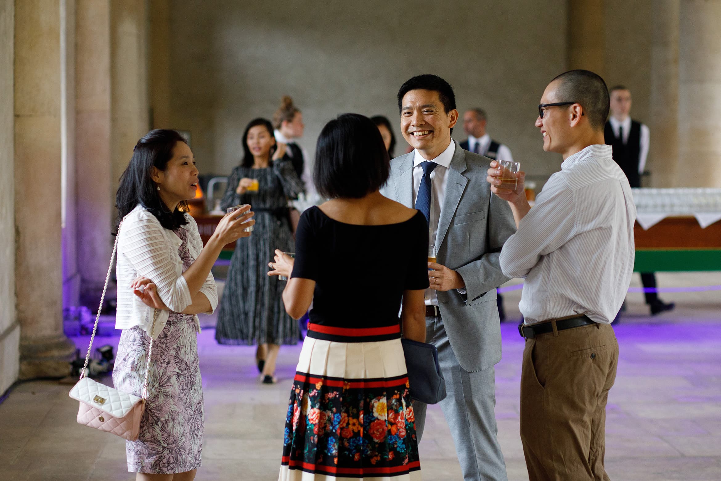 wedding guests enjoying a drink