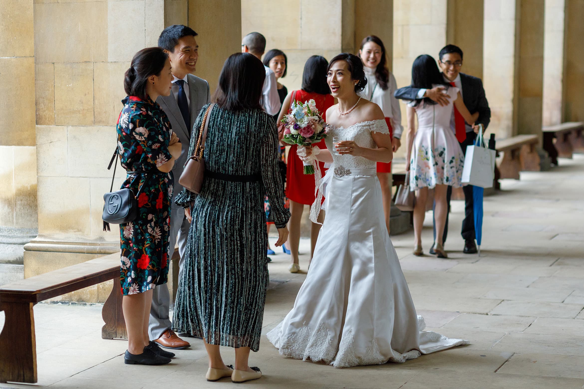 the bride greets her guests at a trinity college wedding