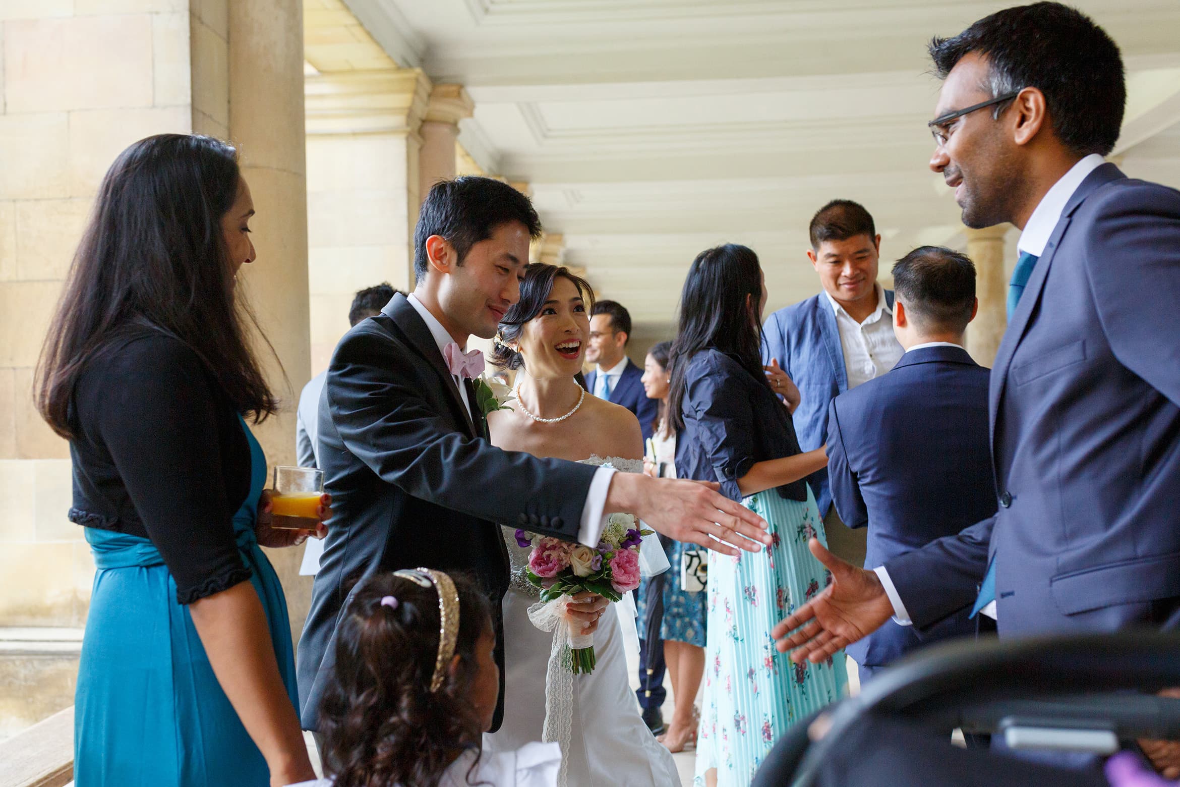 the groom greets his guests