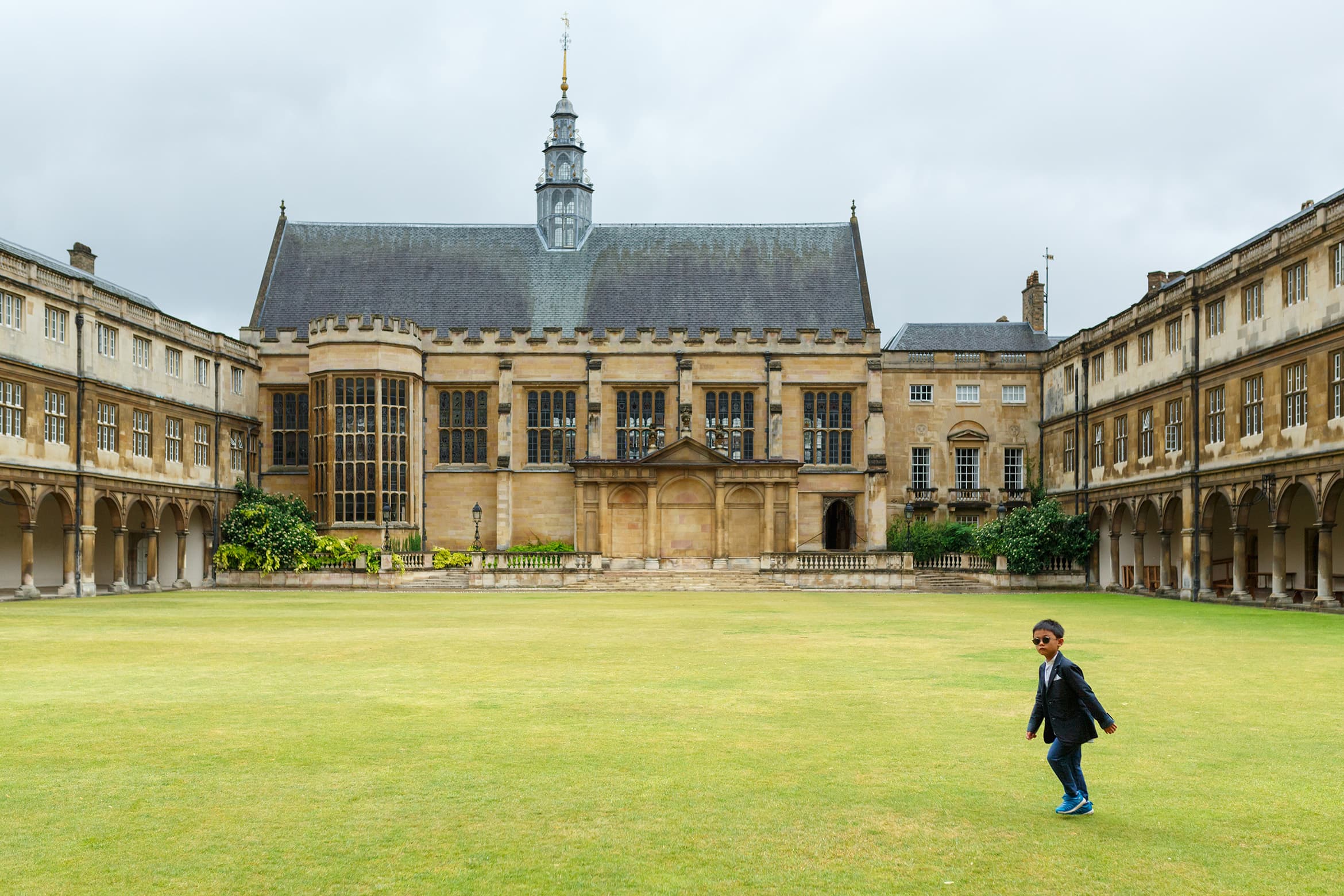 a young wedding guest on the lawn 