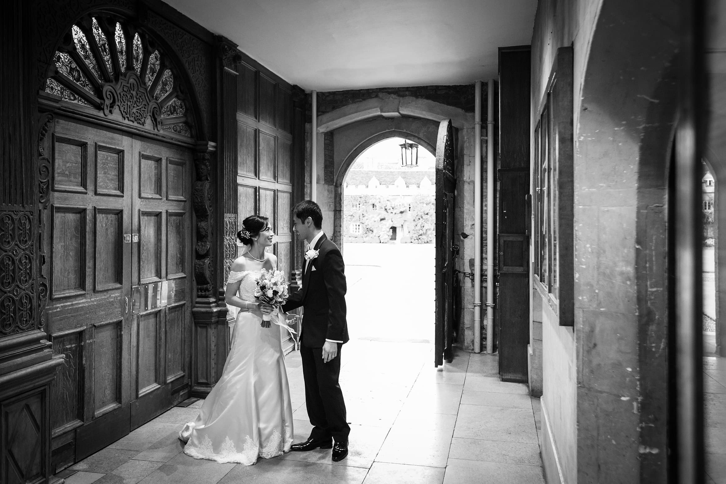 bride and groom share a moment outside the dining hall